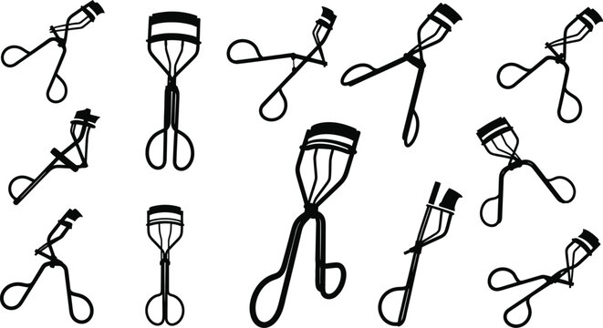 Collection of various eyelash curlers in different orientations
