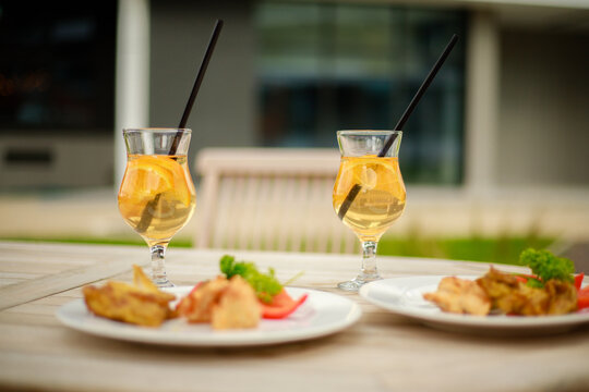 Refreshing Drink and Delicious Food at an Outdoor Cafe