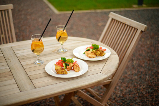 Refreshing Drink and Delicious Food at an Outdoor Cafe