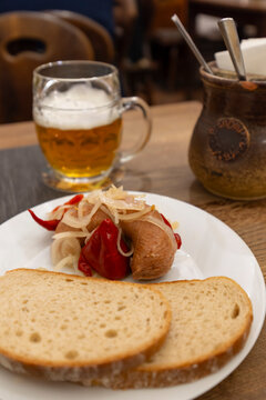 Pickled sausage utopenec with bread and beer in Cesky Krumlov
