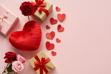 Red Heart Shaped Cushion with Gift Boxes and Roses in Soft Pastel Pink Background with Warm Lighting for Valentines Day