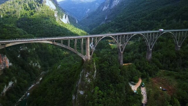 Aerial Forward Flight Over Durdevica Tara Bridge into Deep Canyon in Montenegro