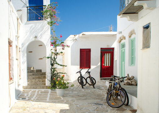 Whitewashed architecture with bikes in Antiparos Chora, Greece.