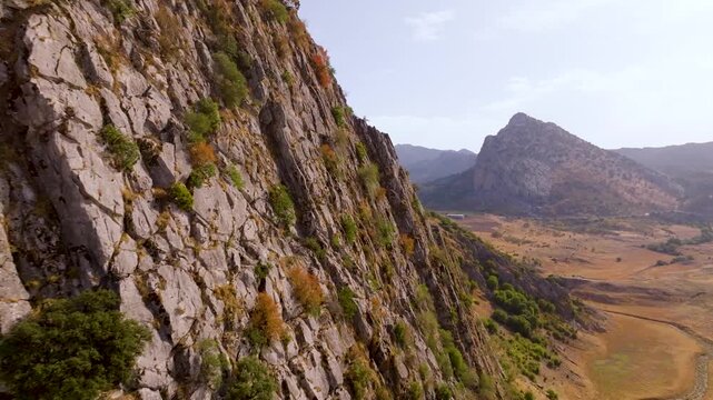 Aerial view of Montejaque dam and massive limestone cliffs in Ronda mountains