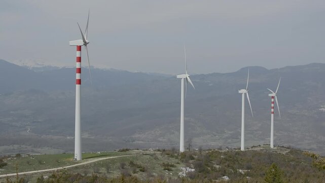 Modern wind turbine in operation on a cloudy day