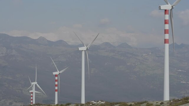 Modern wind turbine in operation on a cloudy day