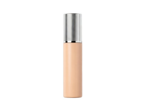 Elegant nude-toned compact foundation with metallic cap and smooth applicator tip.