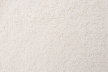 White teddy fabric texture background, top view
