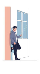 Modern Young Man Leaning Against Building Wall Next To Window Using Mobile Device