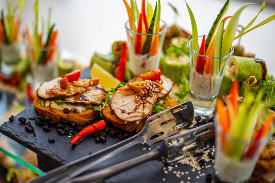 Elegant Mini Sandwiches and Canaps on a Dark Platter