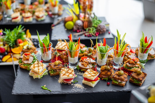 Elegant Mini Sandwiches and Canaps on a Dark Platter