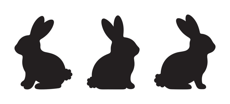 Three black rabbit silhouettes in profile view are depicted in a minimalist graphic style, showing the cute animals sitting with long ears and fluffy tails for an Easter theme