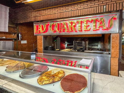 Traditional pizza display at Las Cuartetas pizzeria, Buenos Aires