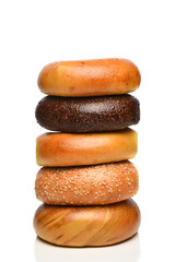 A stack of 5 Fresh Bagels with Pumpernickel, Sesame, Egg, Plain and French Toast