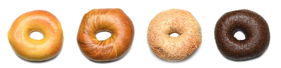 Four Bagels on white - Pumpernickel, Sesame French Toast and Egg Bagels in a row shot from directly above. © Steve Cukrov