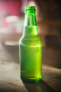 sunlight shinning through a bottle of beer