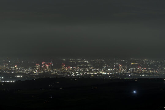 Manchester cityscape, viewed from miles away in the Peak District