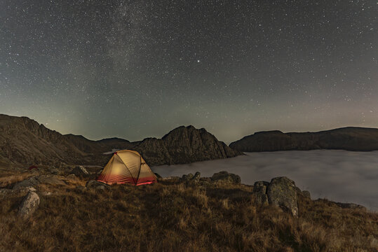 Wonderful camping scene with a tent above a cloud inversion weather in Snowdonia, UK