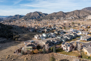 Obraz premium Aerial view of New Castle, Colorado residential area under sunny late autumn cloudscape.