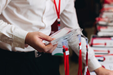 Checking in on conference congress forum event, registration desk table, visitors and attendees...