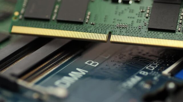 DDR5 RAM module positioned above DIMM slot on motherboard