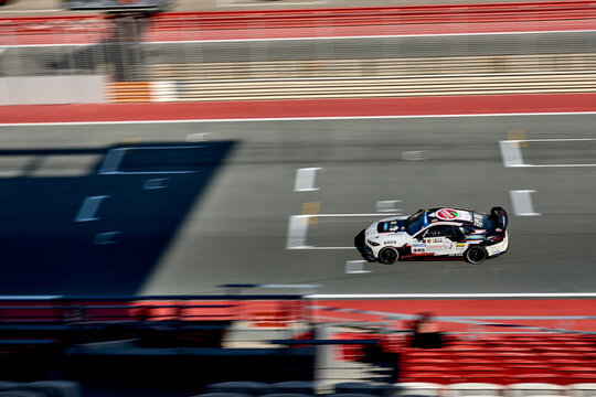 UAE, Dubai, 18 January 2026: 24h series racing supercars on the circuit, Battle of the teams, long exposure photography, supercars drive past at high speed, pitstops, training runs, watching people, 
