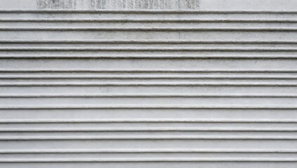 White painted horizontal siding shows signs of aging on a building exterior
