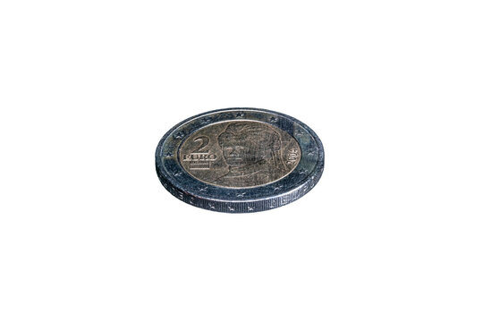 Tilted view obverse side of a 2004 Austrian 2 euro coin featuring peace activist Bertha von Suttner. The bimetallic surface displays her portrait, the year, and twelve stars on the outer ring.