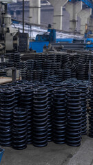 Obraz premium large metal springs and parts for a train. train and freight car manufacturing plant. metallurgical production, metal processing, heavy industry manufacturing process, factory