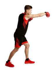 Athletic man in red boxing gloves fighting on white background
