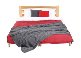 Large bed with fresh linens isolated on white