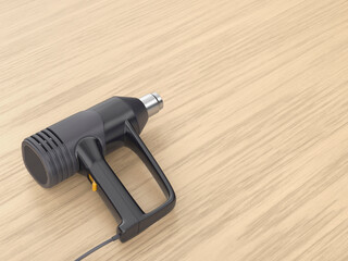 Industrial electric heat gun on wooden desk