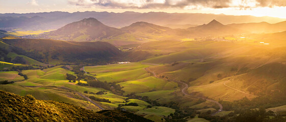Fototapeta premium Panoramic photograph of hills at sunset, sunrise, and valley