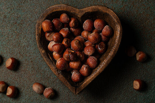 Hazelnuts in a heart shaped  bowl