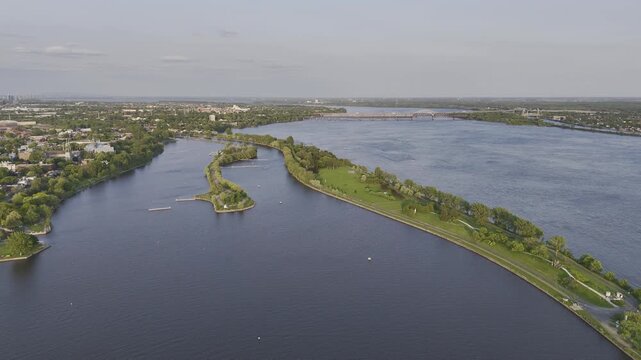Aerial view of Rene-Levesque Park lighthouse peninsula in Lachine, Montreal along St Lawrence River at sunset. g.