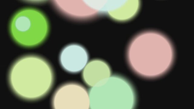 Vibrant colorful bokeh lights on dark background with twig