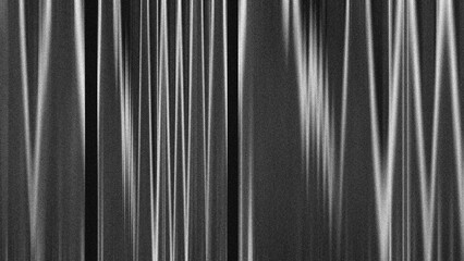 Fototapeta premium Abstract black and white grainy texture with vertical motion blur lines.