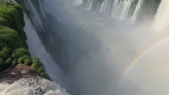 Breathtaking View Of The Devil's Throat Waterfall In Iguazu Falls With A Rainbow In Argentina-Brazil Border. Aerial Shot