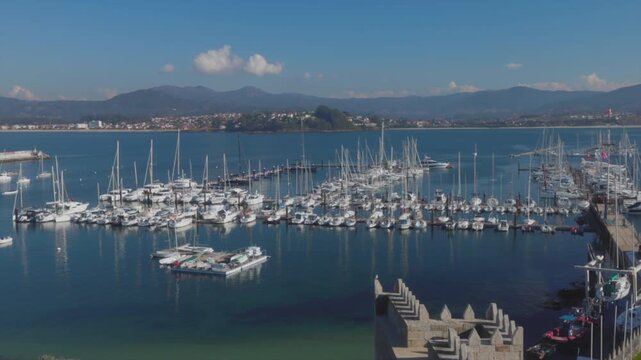 Panoramic View of Baiona Harbor with Sailboats and Yachts
