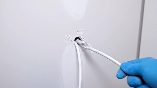 hands connecting electrical wires