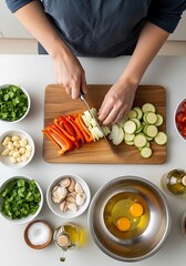 Preparing a colourful vegetable stir-fry with fresh ingredients on table