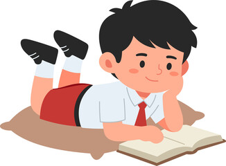 A young boy lying on the floor reading a book, ideal for educational, children's, or literacy content.