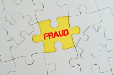 Fototapeta premium FRAUD word alphabet letters on puzzle