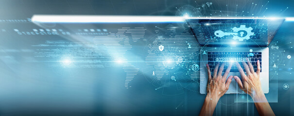 Security analyst using a laptop with access management data authentication systems, identity...