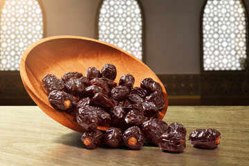Dates fruit in plate on wooden table, eid adha mubarak concept