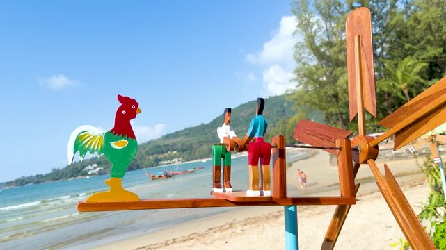 Handcrafted Wooden Wind Spinner Spinning on a Tropical Beach in Phuket