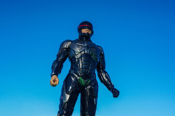 Naklejka premium a Robocop statue at the Tangga Arung traditional market, Tenggarong with blue sky