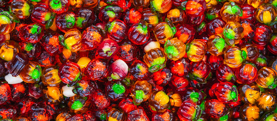 Panoramic background of assorted colorful marmalade candies. View from above. Jelly candies