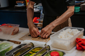 Professional and experienced sushi chef is make sushi. © Anastasia