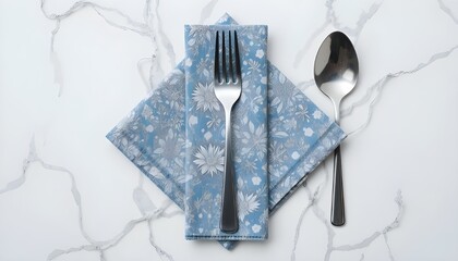 A top view of a napkin, fork, and spoon on a white background with a clipping path